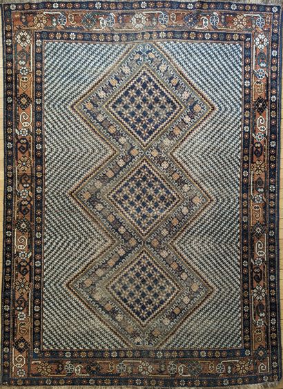 Oriental wool carpet decorated with three...