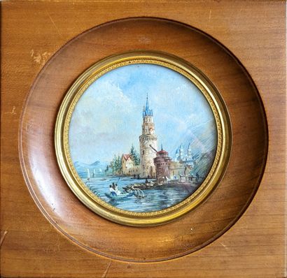 Two round miniatures, one depicting a landscape...