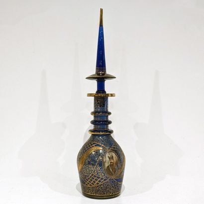 Large blue-tinted glass decanter, decorated...