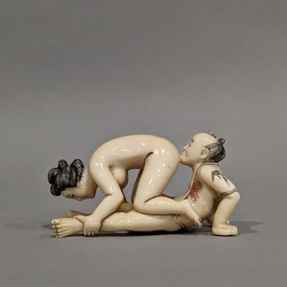 Japan, 20th century. Erotic Okimono, featuring...