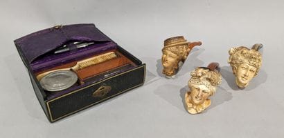 Set of three meerschaum pipes featuring women's...