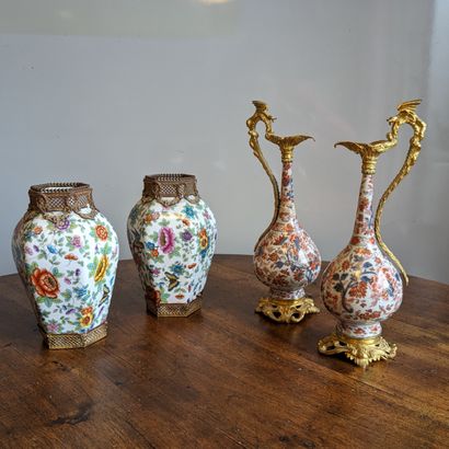 A pair of small ewers with high-necked flasks...