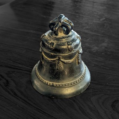 Small bronze bell decorated with garlands...