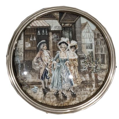 Round miniature depicting a man and two women...