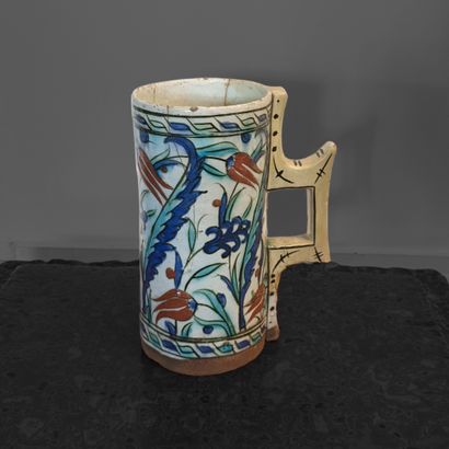 In the Iznik style. Earthenware pitcher decorated...