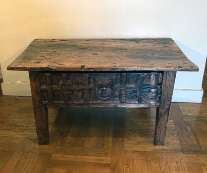 Rustic fruitwood coffee table. The wide drawer...