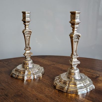 Pair of silver-plated bronze torches, the...