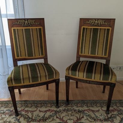 Pair of mahogany chairs, the flat back surmounted...