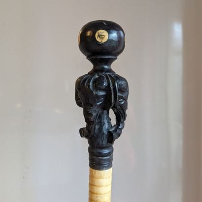 Bone cane engraved with scenes and characters...