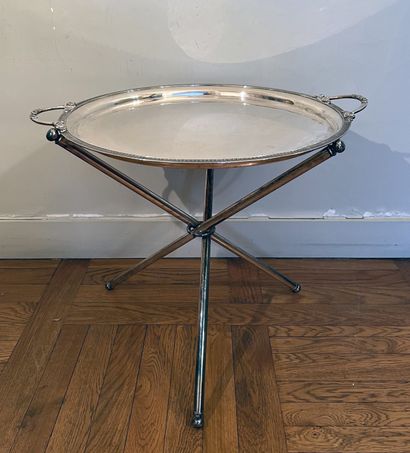 Round silver-plated serving tray. The rim...