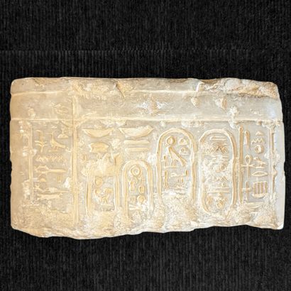 Fragment of a limestone stele with bas-relief...