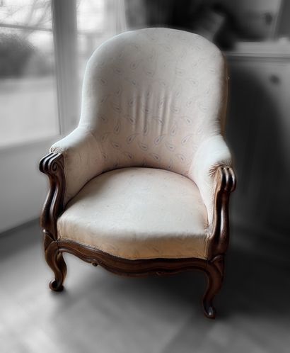 Mahogany armchair, wavy back. Worn and faded...
