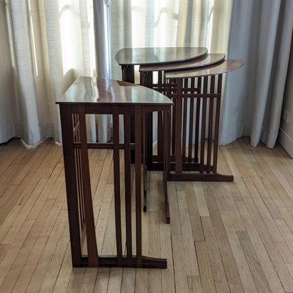 Suite of four corner nesting tables in varnished...