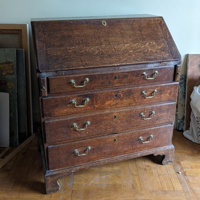 Oak scriban chest of drawers, opens with...