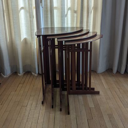 Suite of four corner nesting tables in varnished...