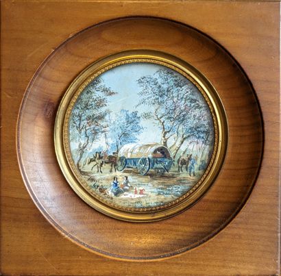 Two round miniatures, one depicting a landscape...