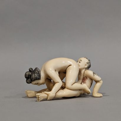 Japan, 20th century. Erotic Okimono, featuring...