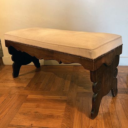 Carved natural wood bench, the uprights with...