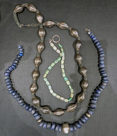 Three necklaces: one with silver (800) olive...