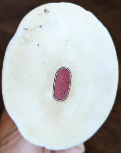Small okimono representing a fisherman. Signed....