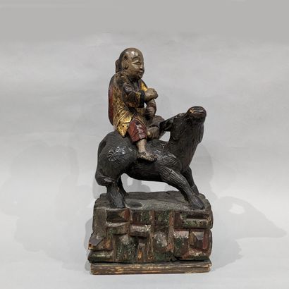 Lao Tseu on his cow. Polychrome painted wood...