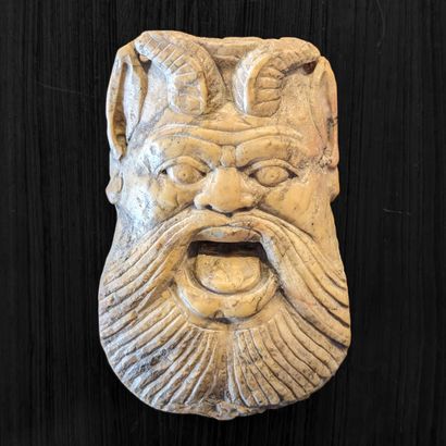 Yellow marble sconce figure carved with a...