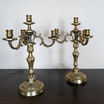 Pair of cast bronze table ends decorated...