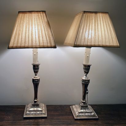 Pair of silver-plated torches decorated with...