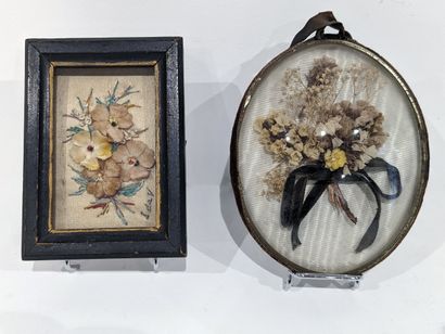 Small domed oval frame containing a bouquet...