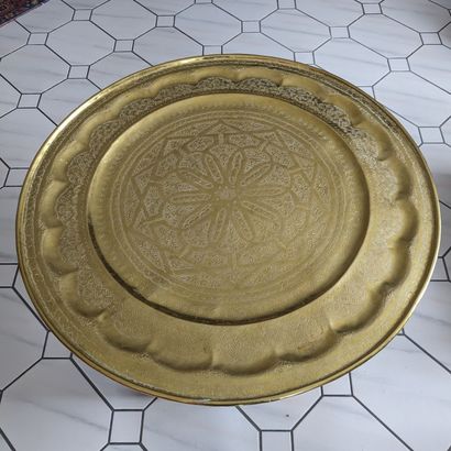 Large round brass tray with stylized chased...