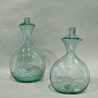 Two slightly green-tinted blown glass shepherd's...
