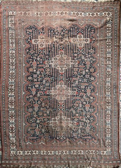 Oriental wool carpet decorated with cruciform...