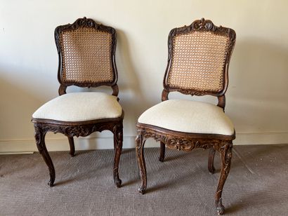Pair of chairs in natural wood, molded and...