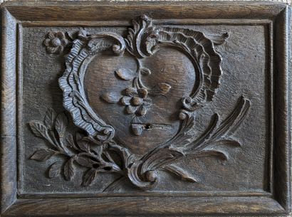 Small carved wood panel decorated with a...