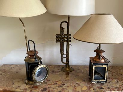 Two hand-held or pendant kerosene lamps in...