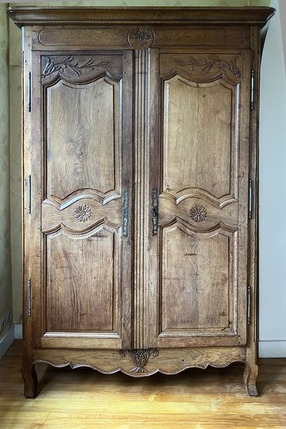 Small molded and carved oak armoire decorated...