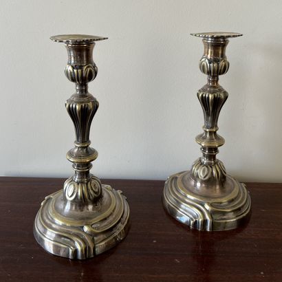 Pair of silver-plated bronze torches, the...