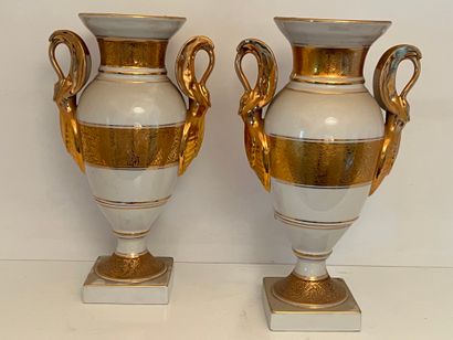 Pair of white porcelain spindle-shaped vases...
