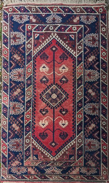 Oriental wool carpet, decorated with blue...