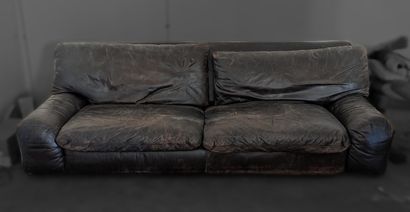 Three-seater sofa upholstered in patinated...