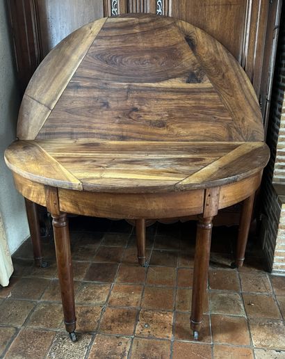 Half-moon table in fruitwood, the top with...