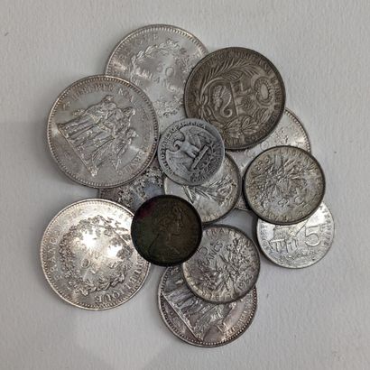 Silver coins: five fifty-franc coins; one...