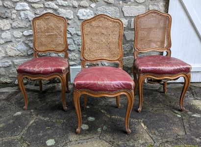 Suite of three natural wood chairs, caned...