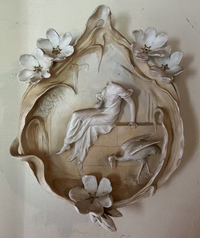 Decorative bisque wall sculpture depicting...