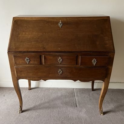 Varnished wood sloping desk, the flap revealing...