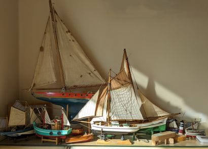 Case of model boats and sailboats.