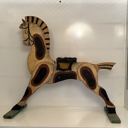 Painted wooden toy featuring a horse, the...