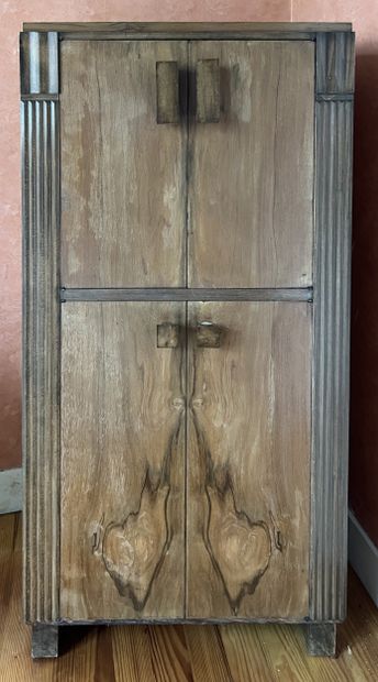Walnut music cabinet with serrated jambs....
