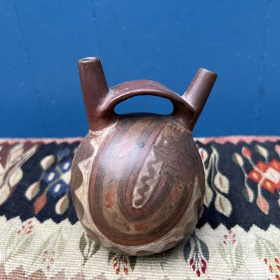 Pre-Columbian art. Small two-spouted vessel...