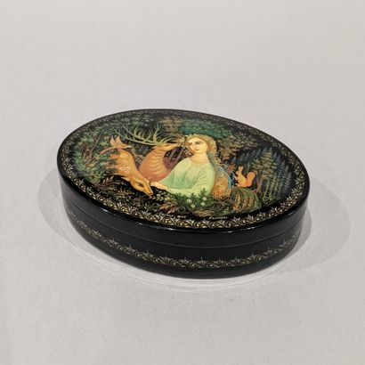 Oval lacquer box with black background, the...